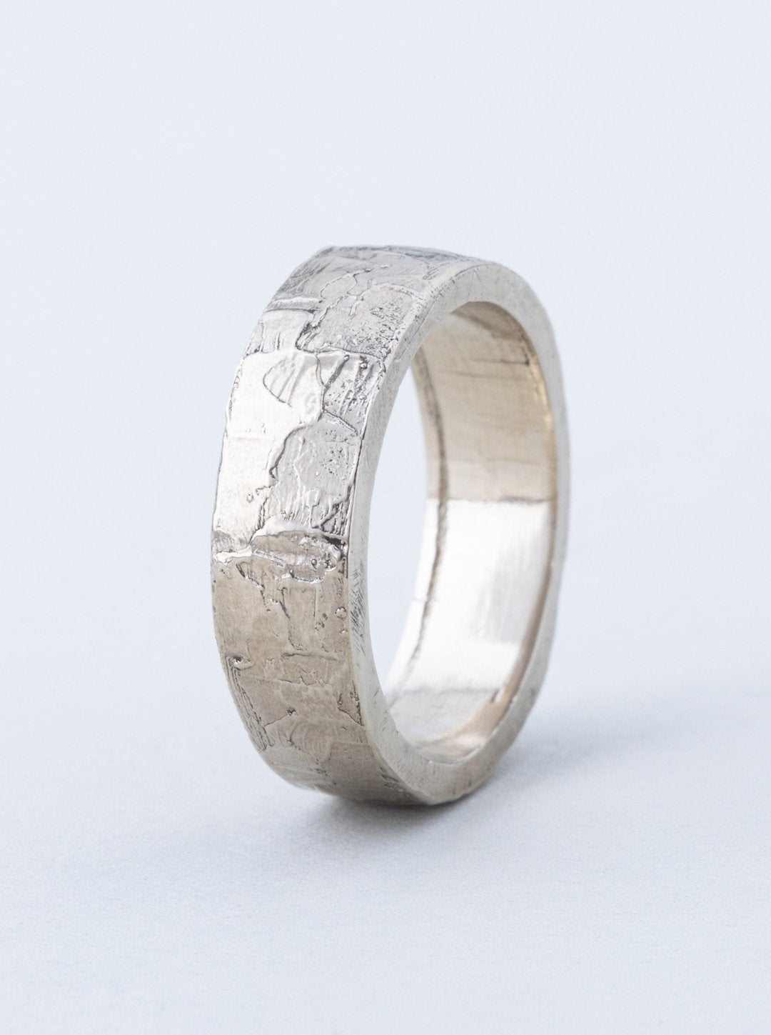 Kate Furman wedding band featuring water texture
