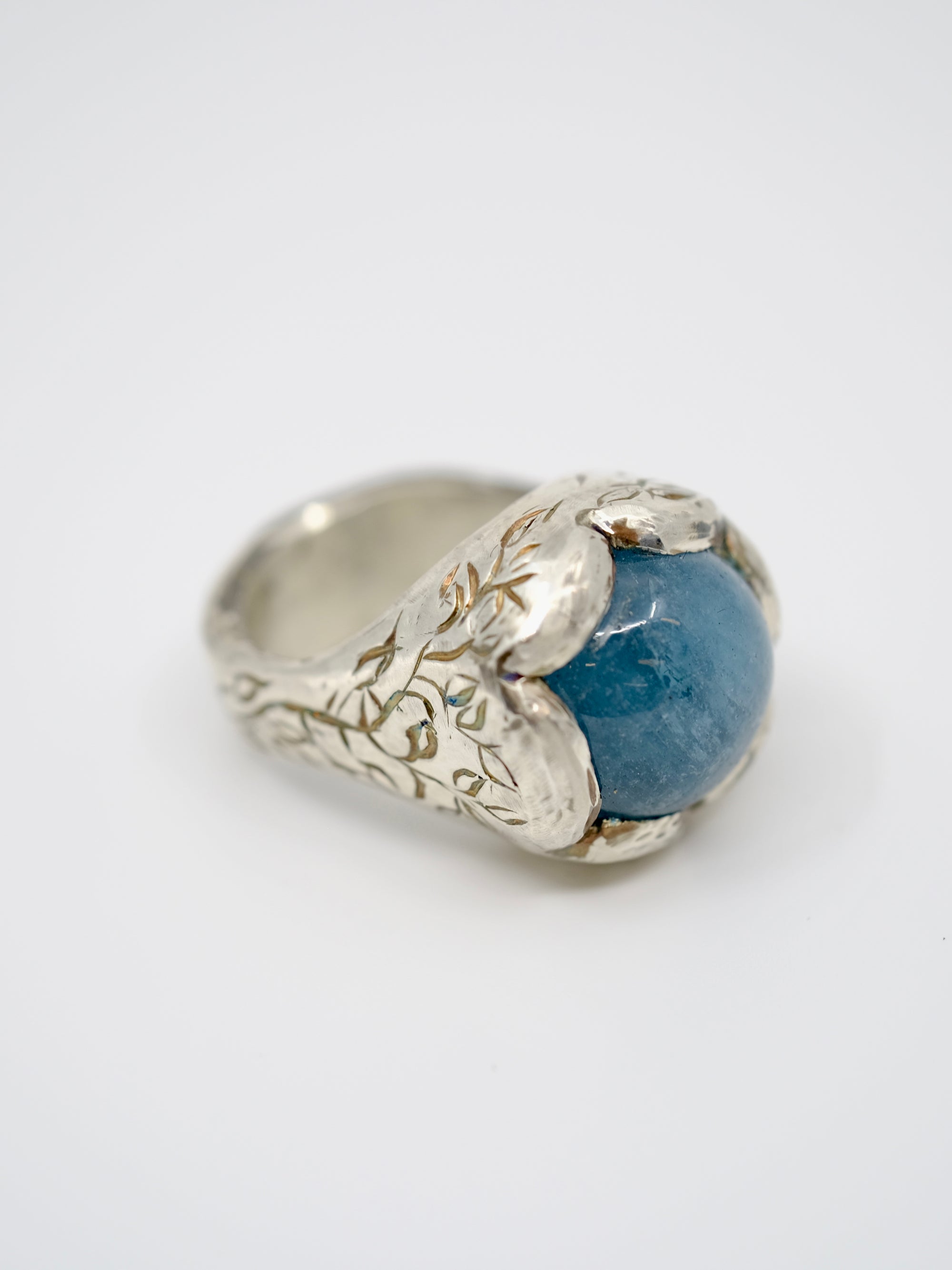 Aquamarine and silver engraved ring