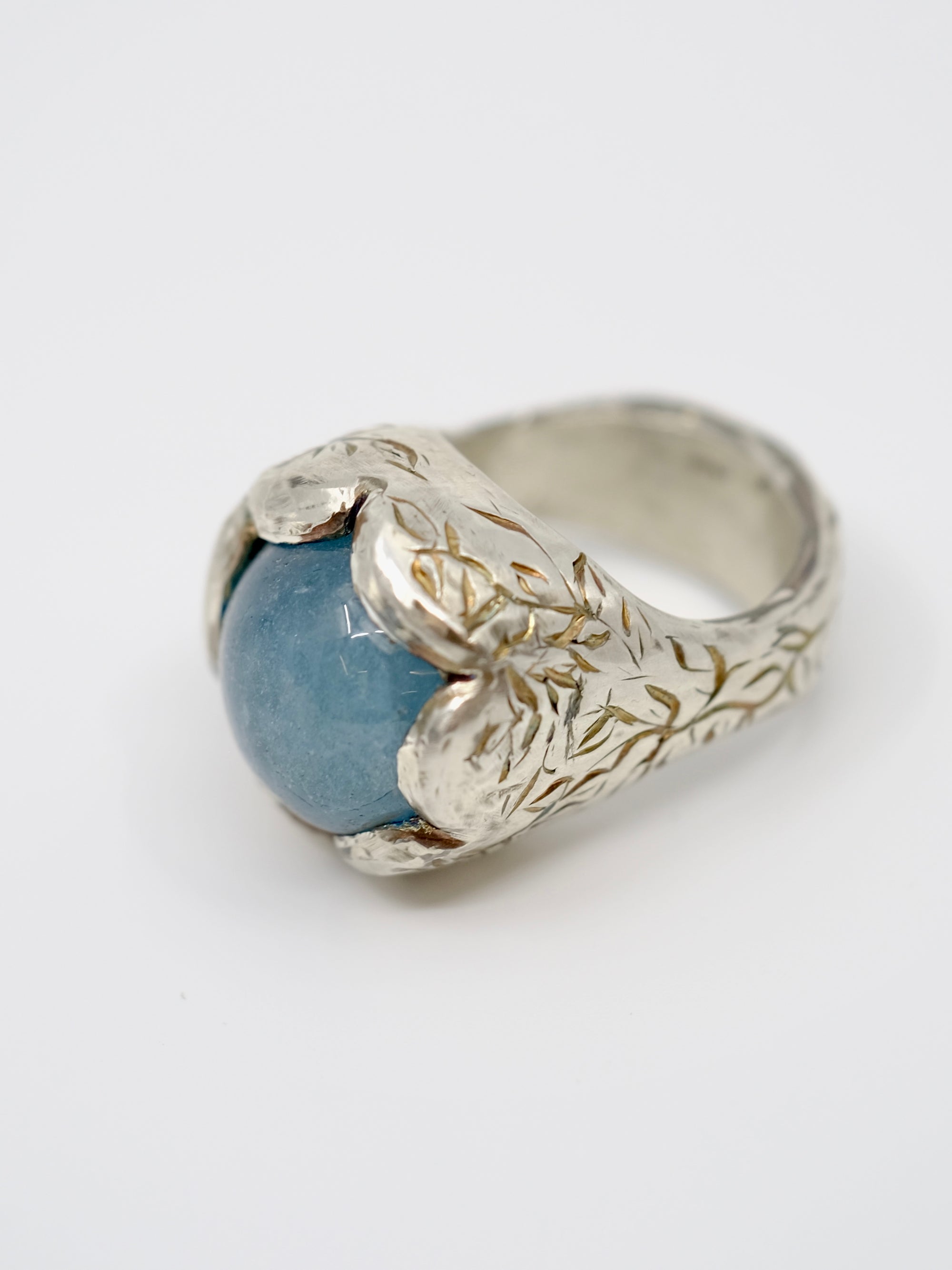 Aquamarine and silver engraved ring