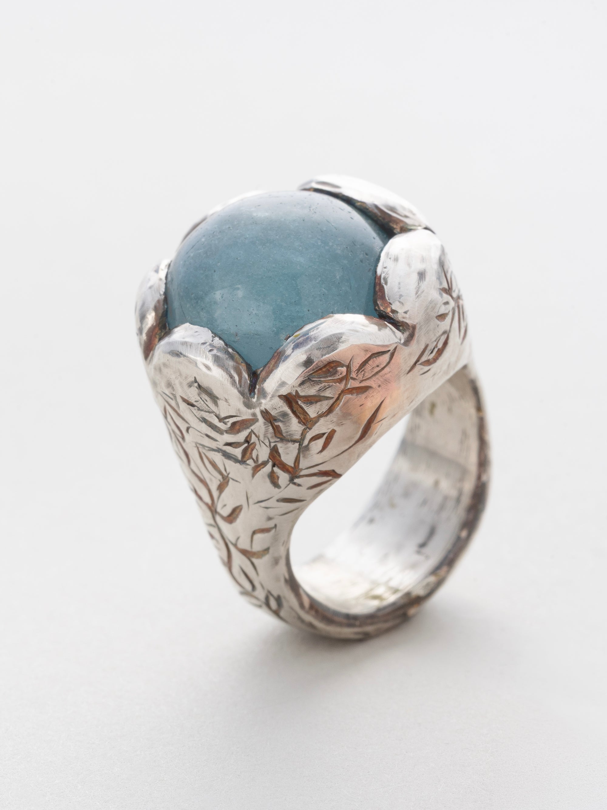 Aquamarine and silver engraved ring