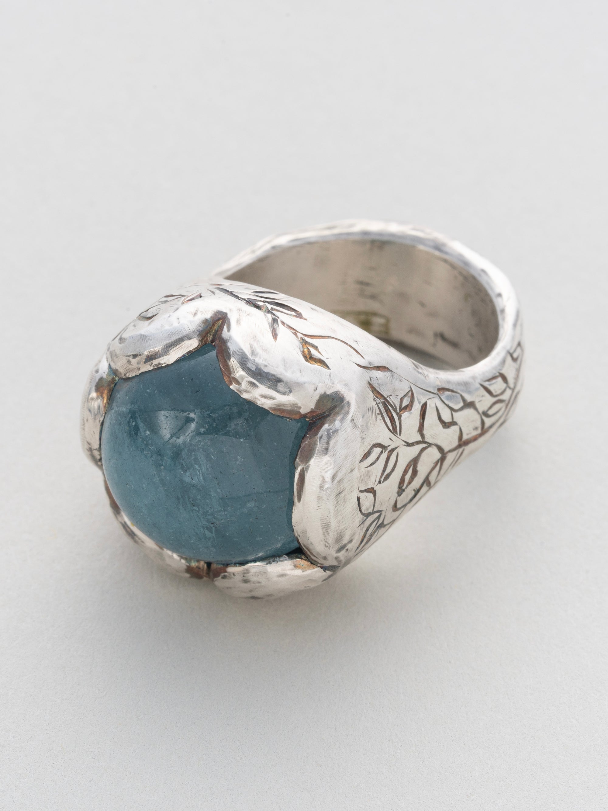 Aquamarine and silver engraved ring