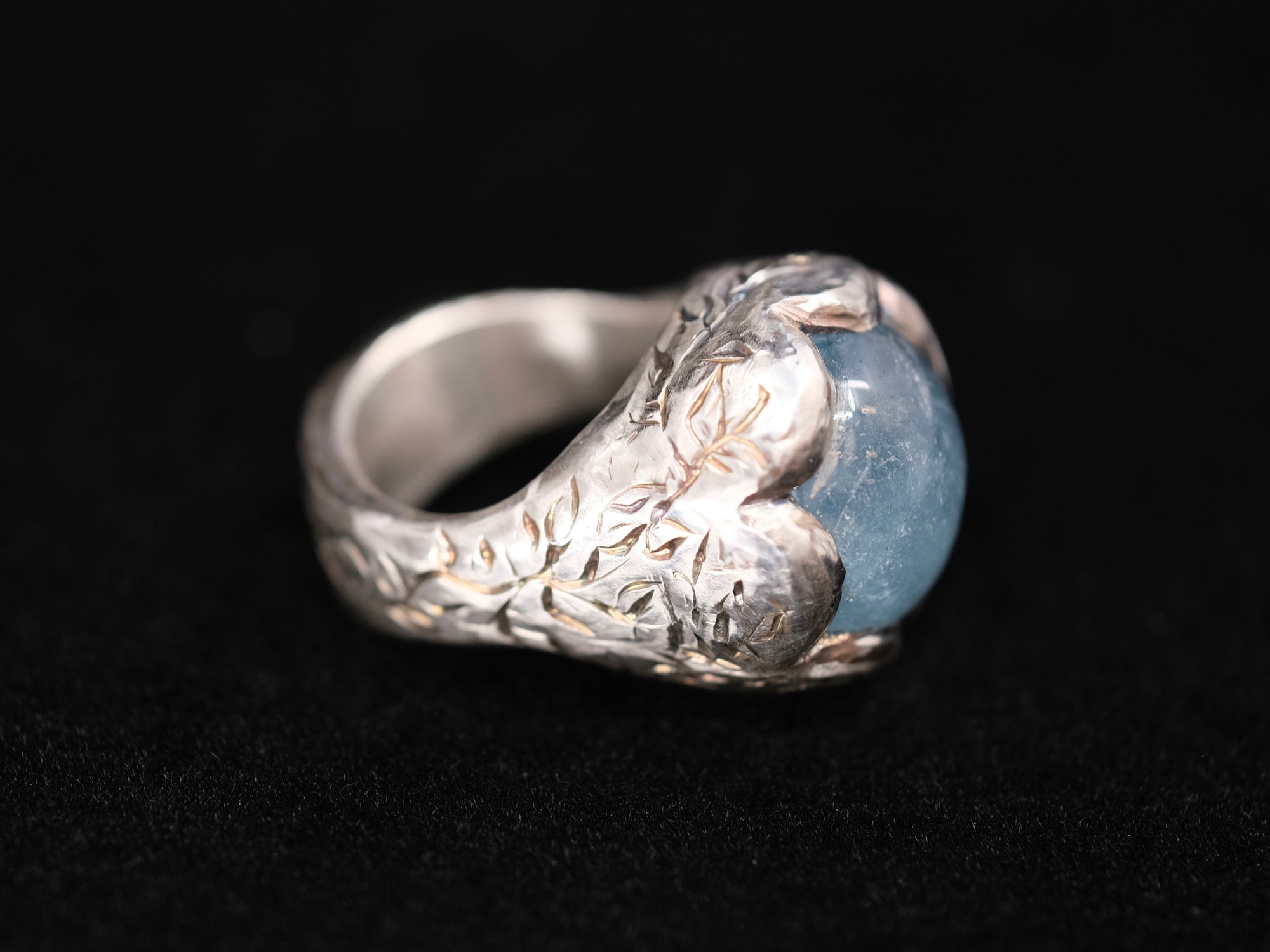 Aquamarine and silver engraved ring